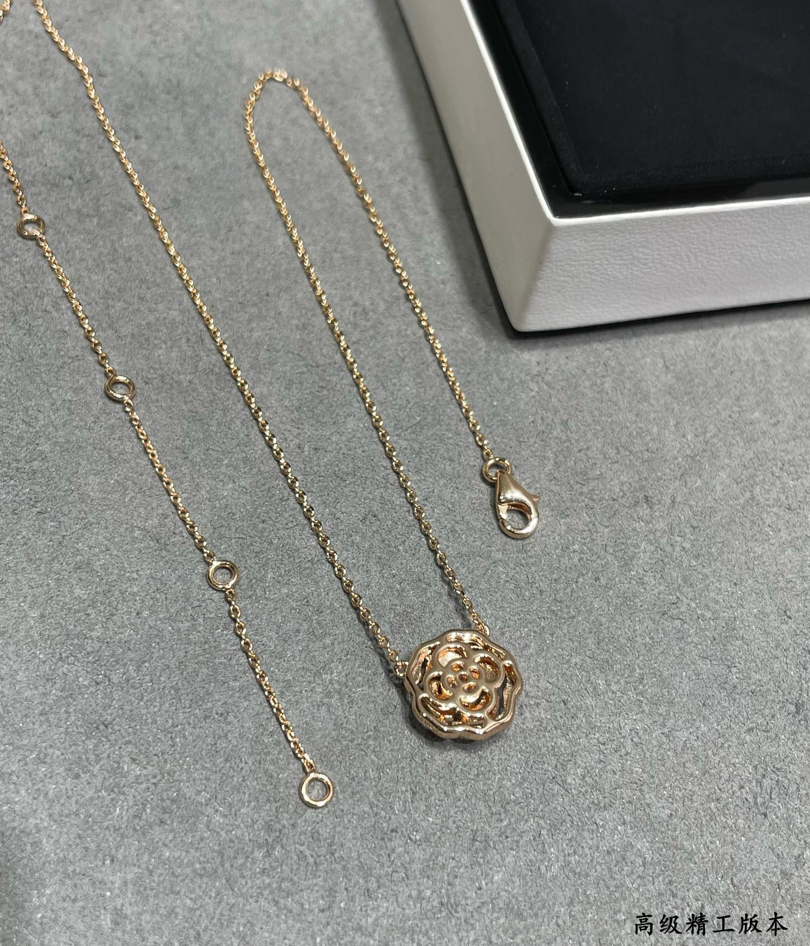 Ch*el camellia japonica necklace