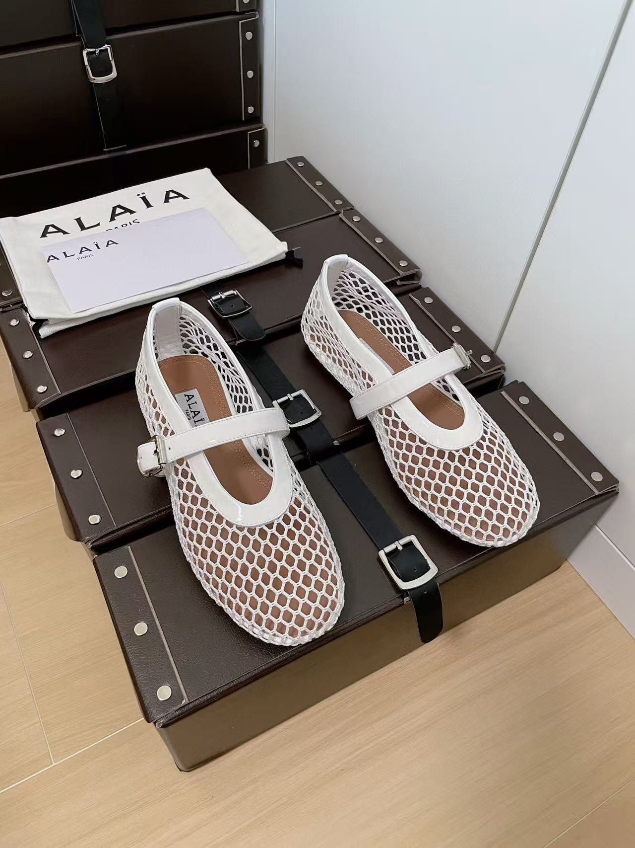 UA ALAÏA BALLET FLATS IN FISHNET