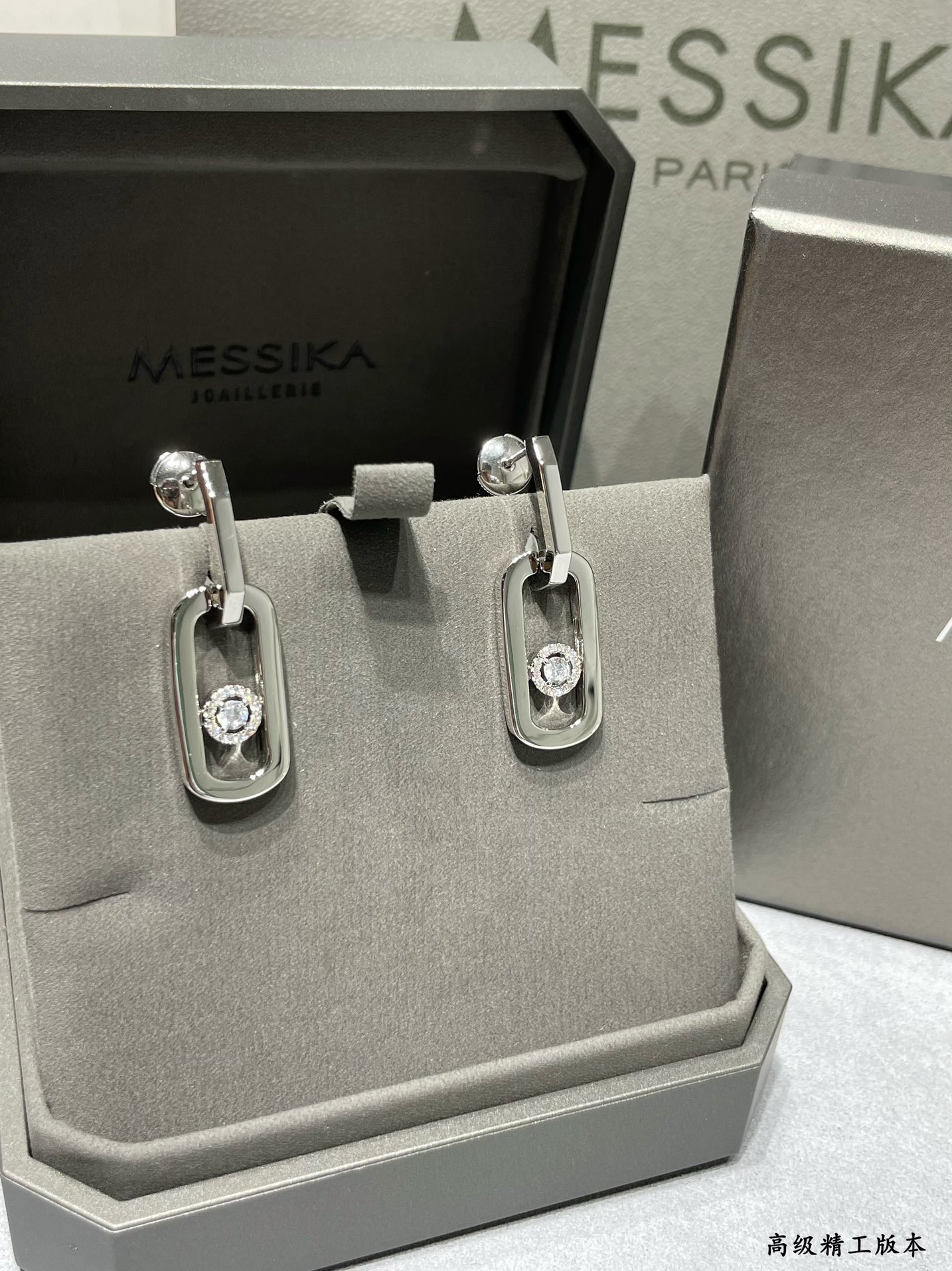 messika large single Di*m*nd moving stud earrings