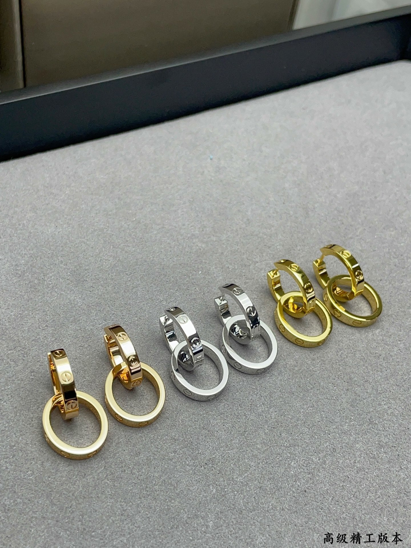 Ca*t*er double ring polished earrings
