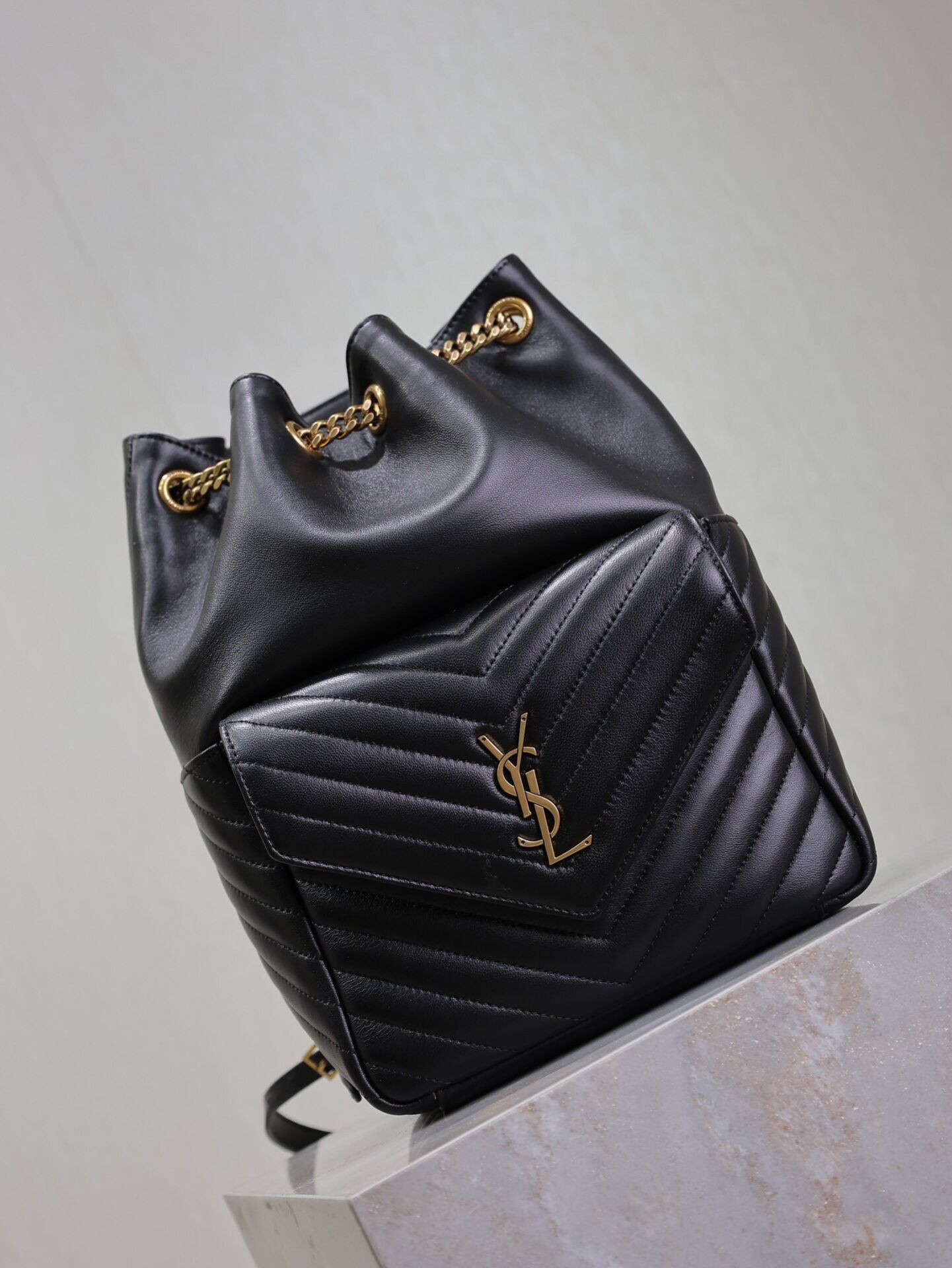 y*l Sa**t Lau*nt joe drawstring quilted backpack 22x29x15cm