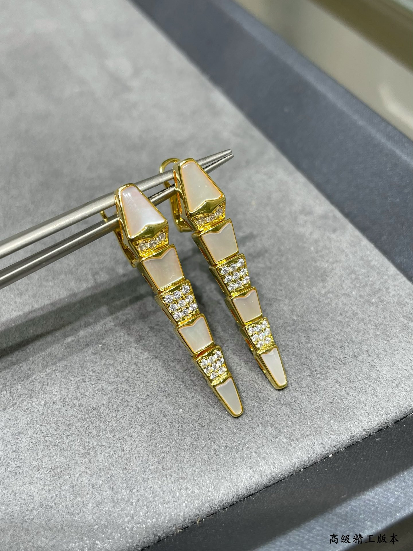 B*l*ai advanced mechanical shell snake earrings