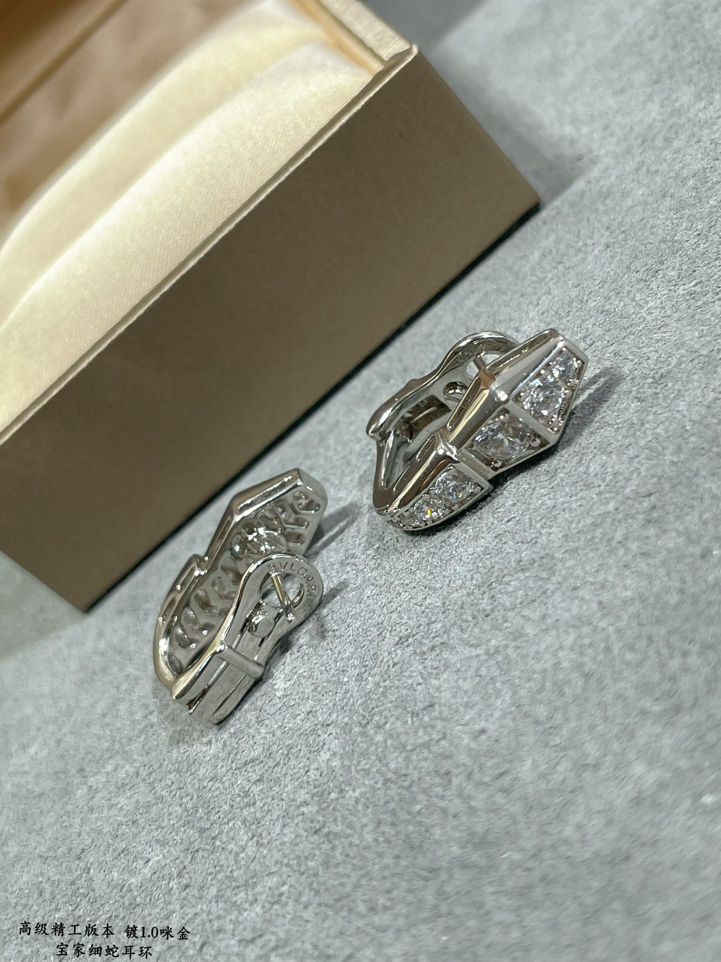 b*l*ai full of Di*m*nd snake earrings