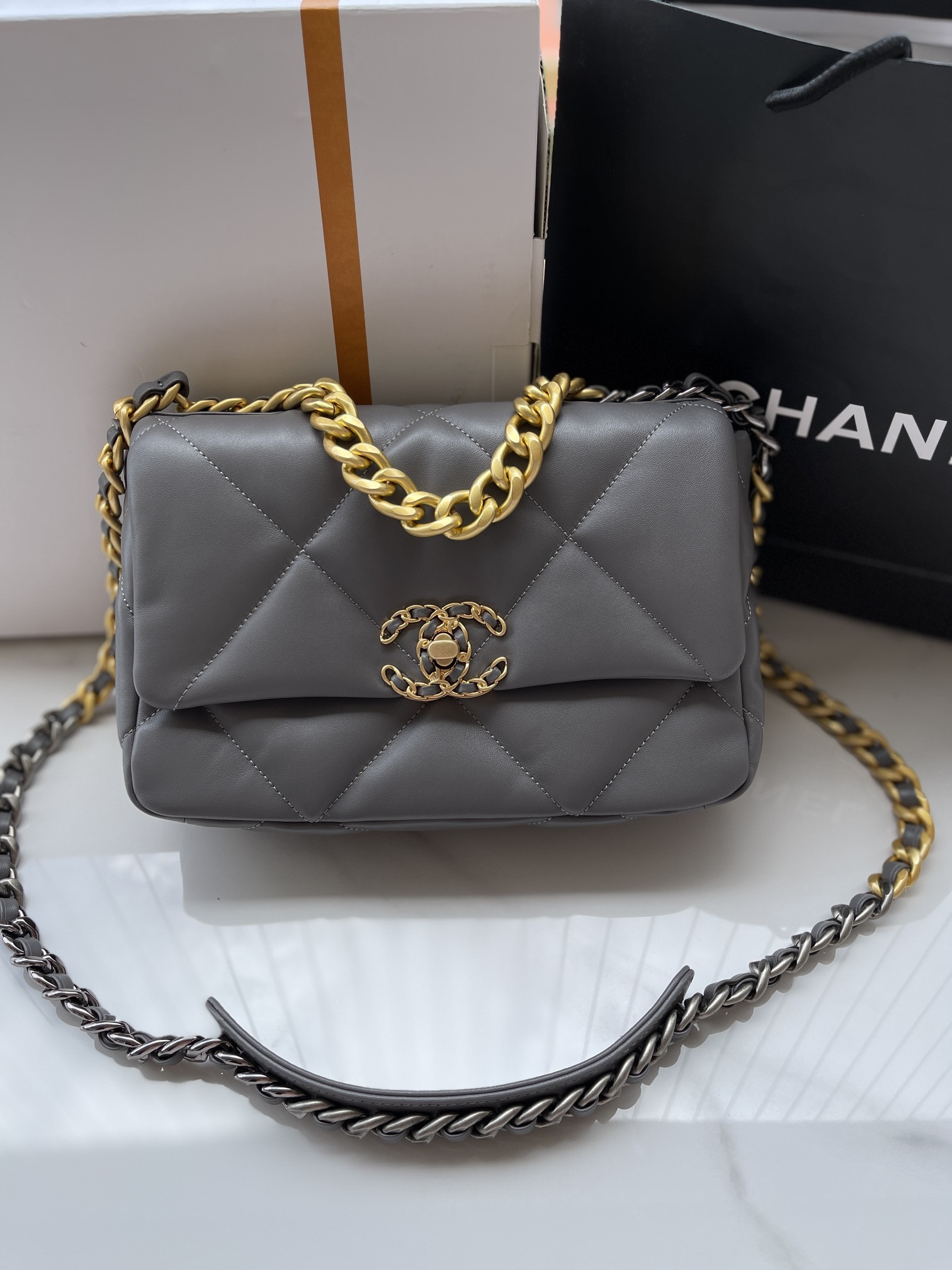 Ch*el 19 handbag shiny leather, gold-tone, silver-tone & ruthenium-finish metal dark gray 6.2 × 10.1 × 3.5 in