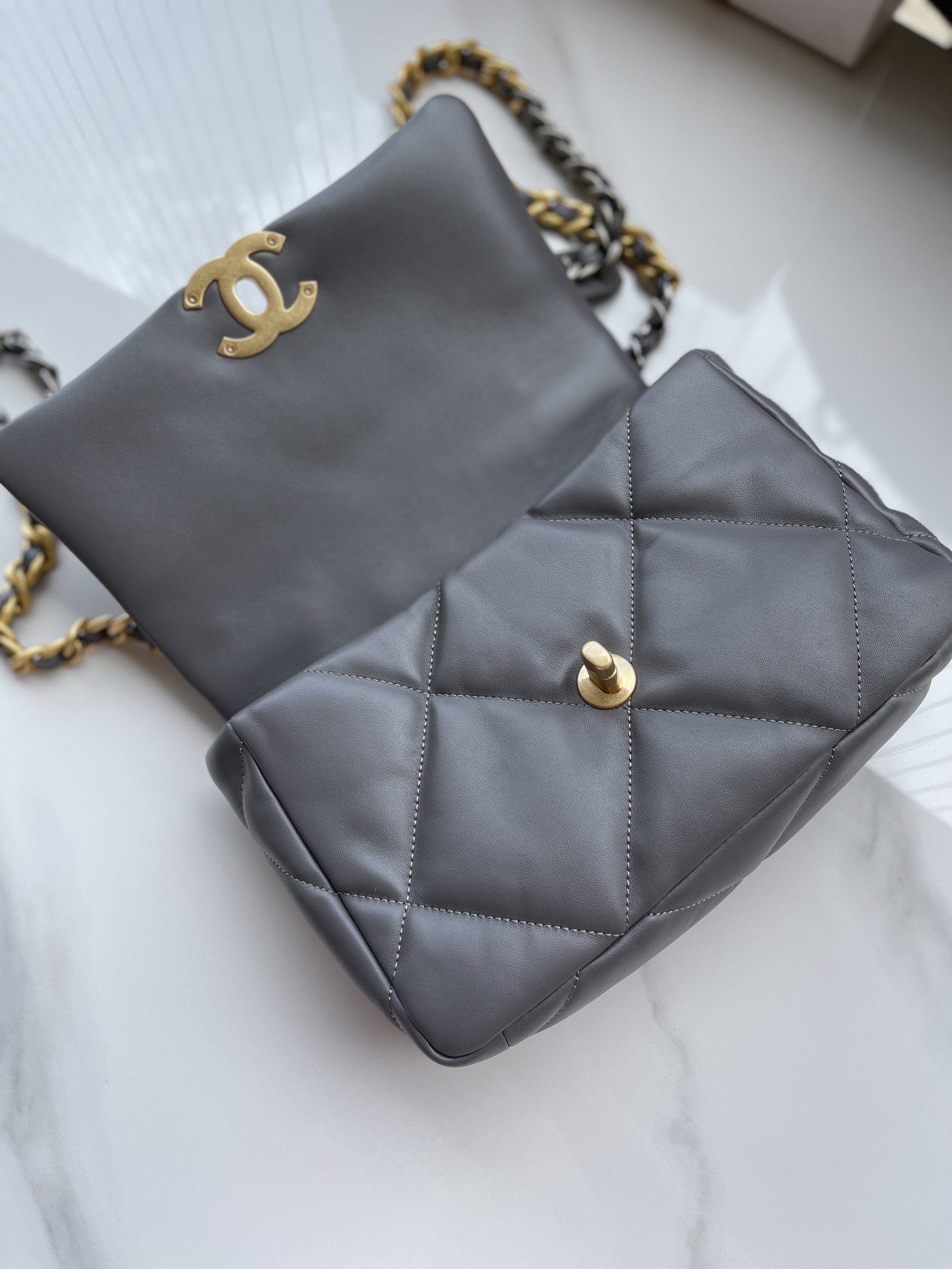 Ch*el 19 handbag shiny leather, gold-tone, silver-tone & ruthenium-finish metal dark gray 6.2 × 10.1 × 3.5 in