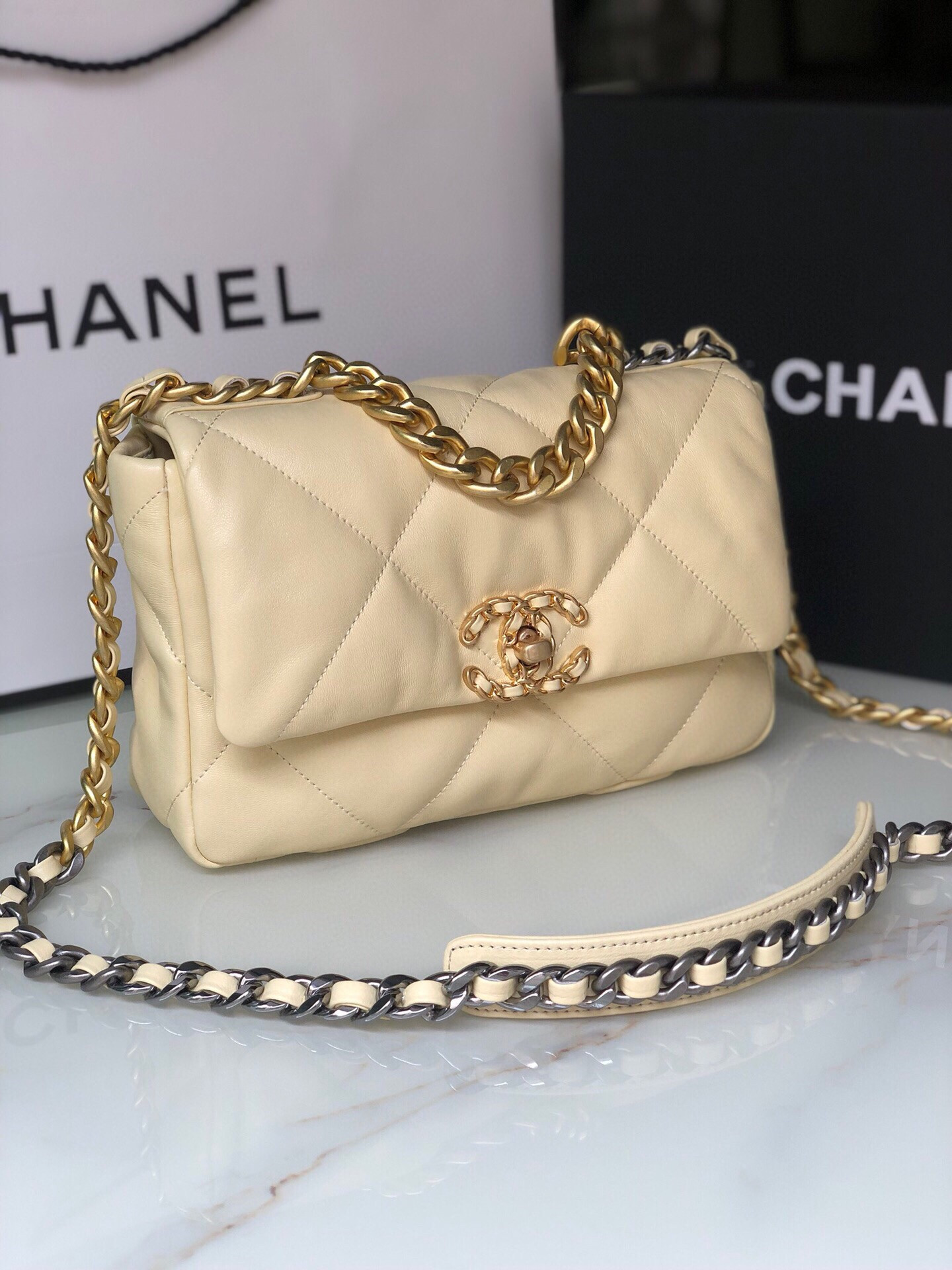 Ch*el 19 handbag shiny leather, gold-tone, silver-tone & ruthenium-finish metal dark yellow 6.2 × 10.1 × 3.5 in