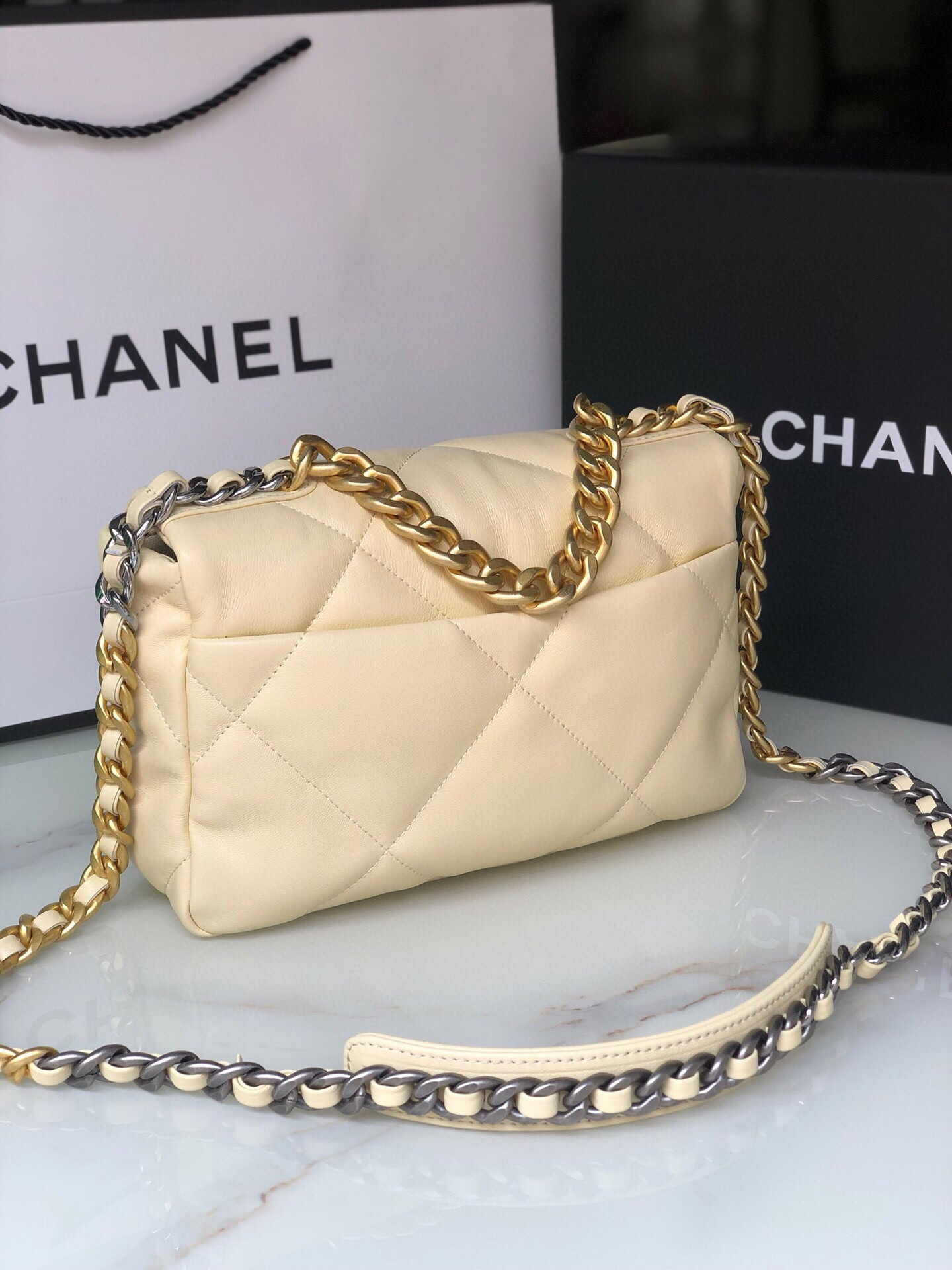 Ch*el 19 handbag shiny leather, gold-tone, silver-tone & ruthenium-finish metal dark yellow 6.2 × 10.1 × 3.5 in