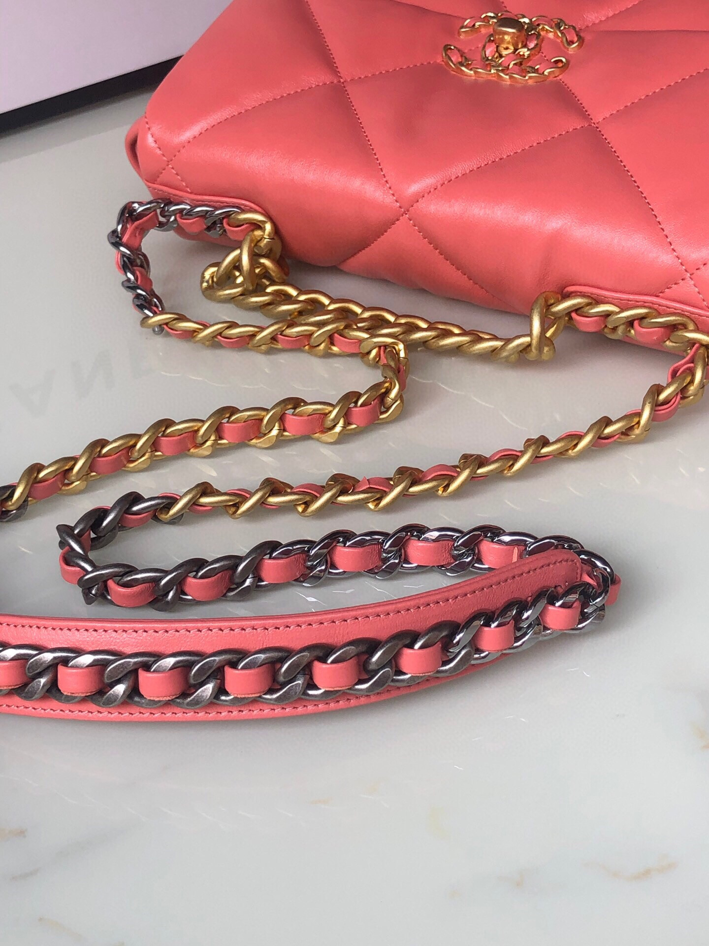 Ch*el 19 handbag shiny pink gold-tone, silver-tone & ruthenium-finish metal 6.2 × 10.1 × 3.5 in
