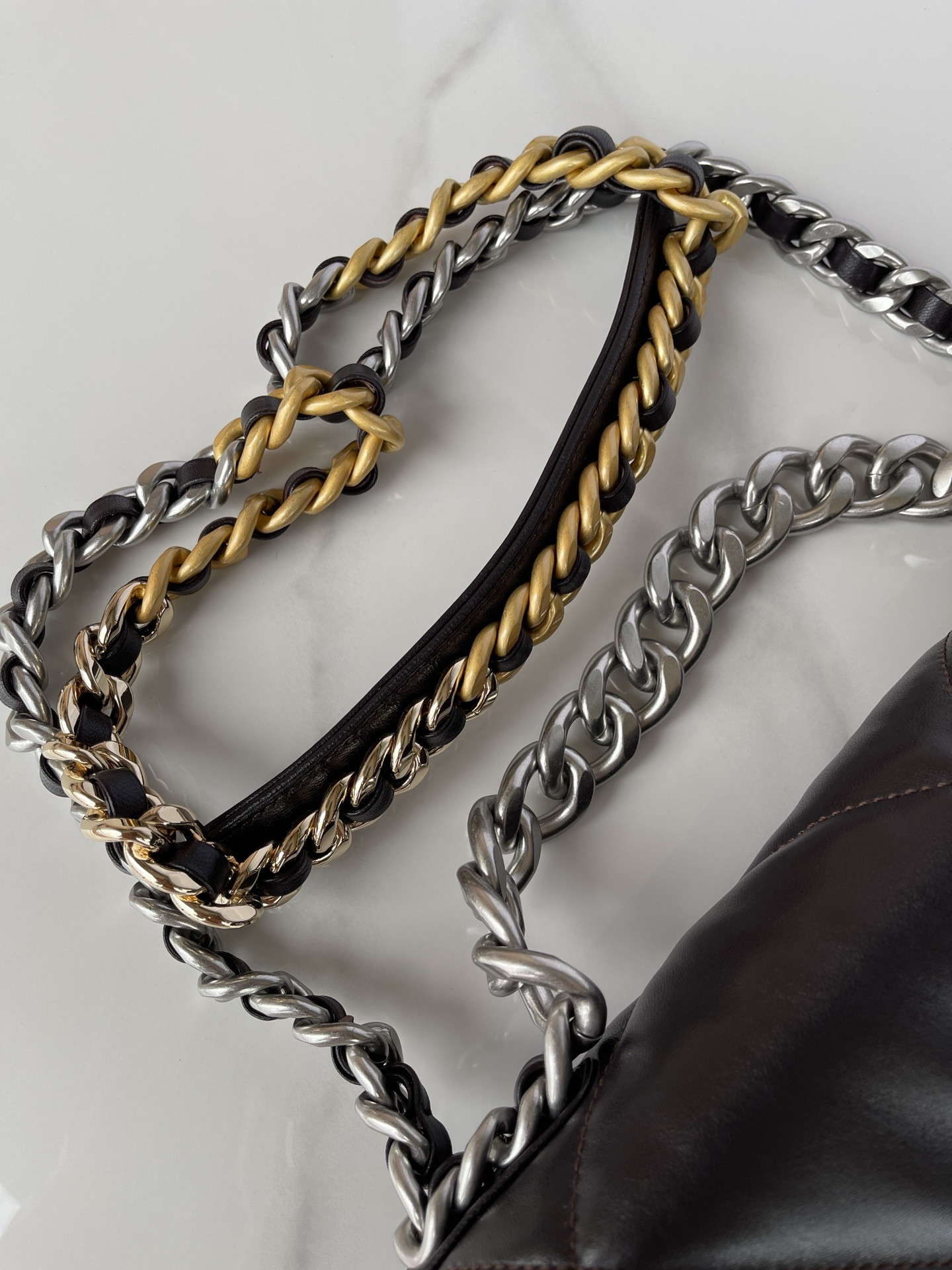 Ch*el 19 large handbag shiny leather black, gold-tone, silver-tone & ruthenium-finish metal 7.8 × 11.7 × 3.9 in