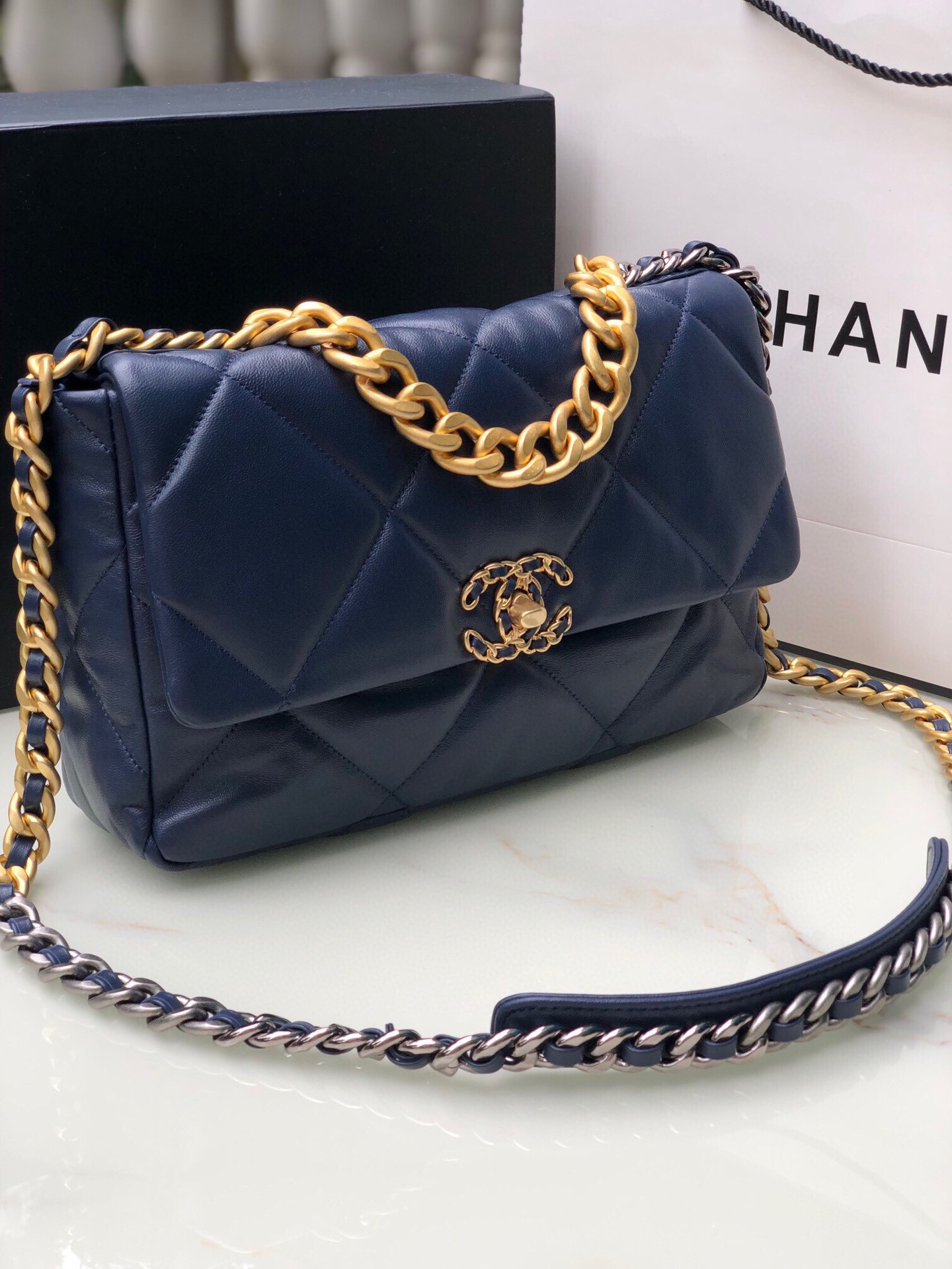 Ch*el 19 large handbag shiny leather, gold-tone, silver-tone & ruthenium-finish metal navy 7.8 × 11.7 × 3.9 in
