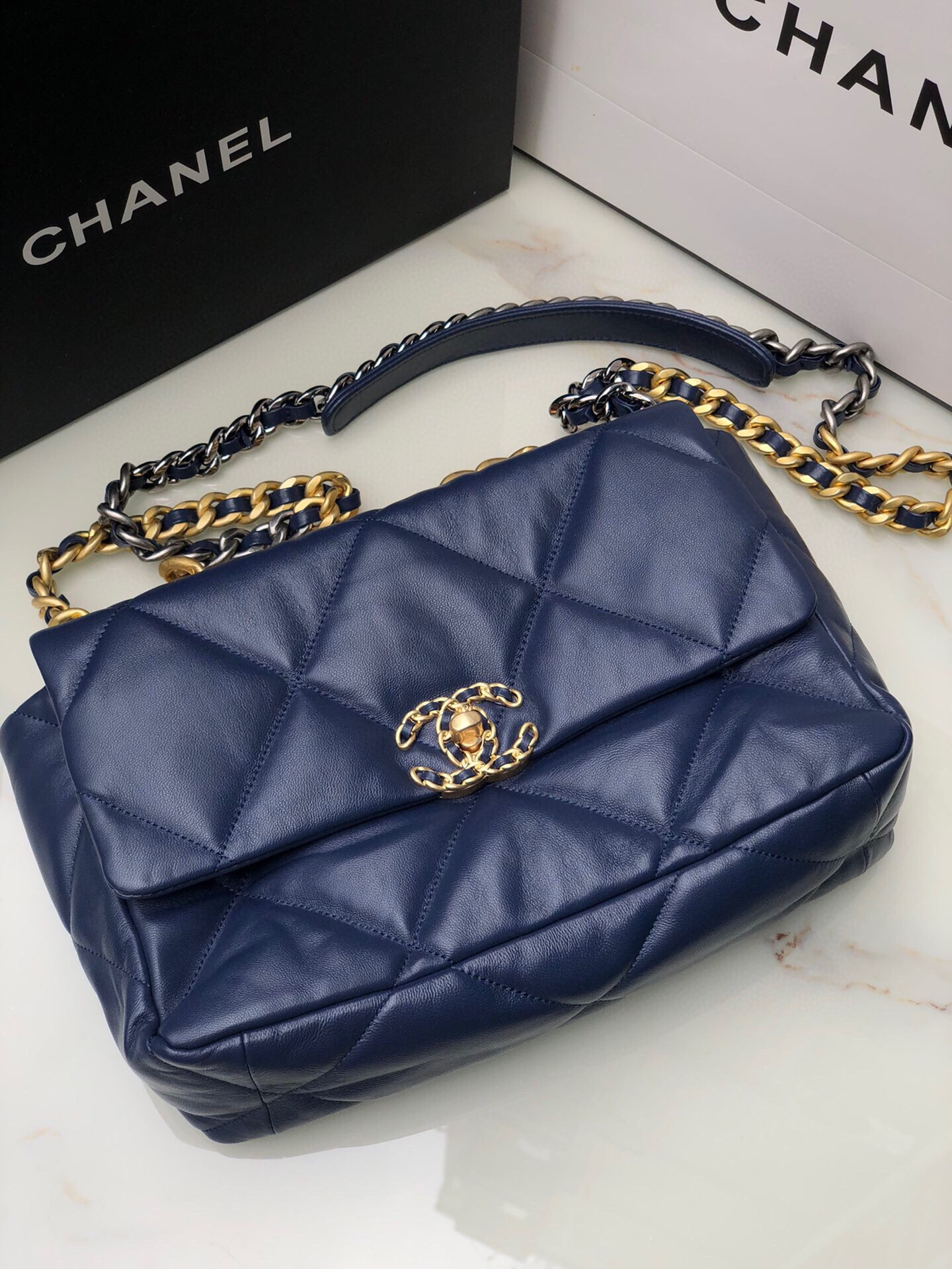 Ch*el 19 large handbag shiny leather, gold-tone, silver-tone & ruthenium-finish metal navy 7.8 × 11.7 × 3.9 in