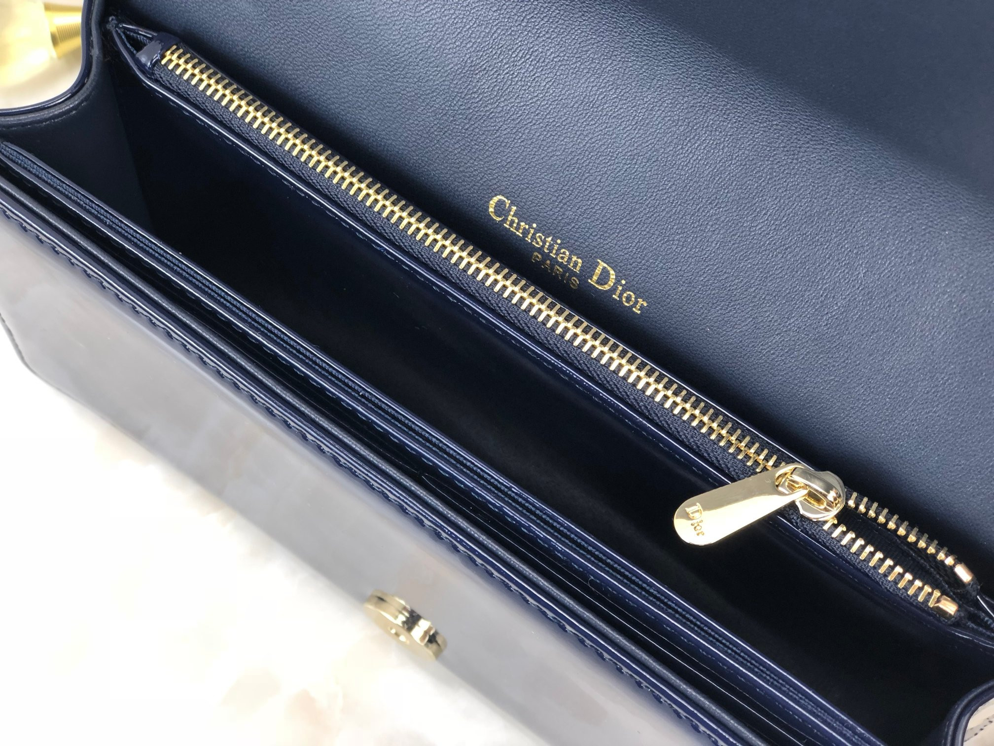 lady D*or pouch  navy patent cannage calfskin 8.5 x 4.5 x 1 inches
