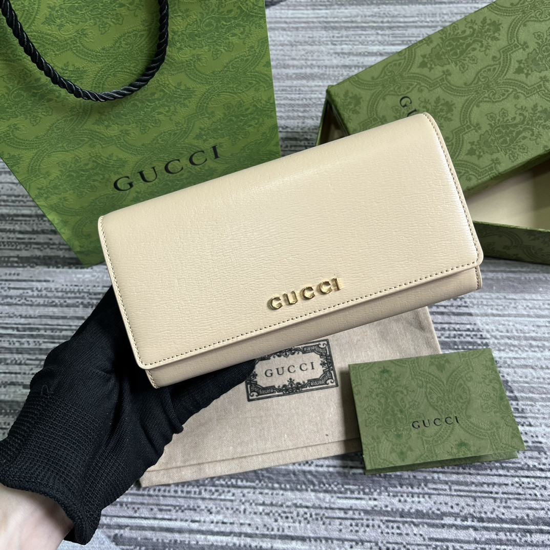 continental wallet with G*u*i script light yellow 7.5"w x 4"h x 1.4"d