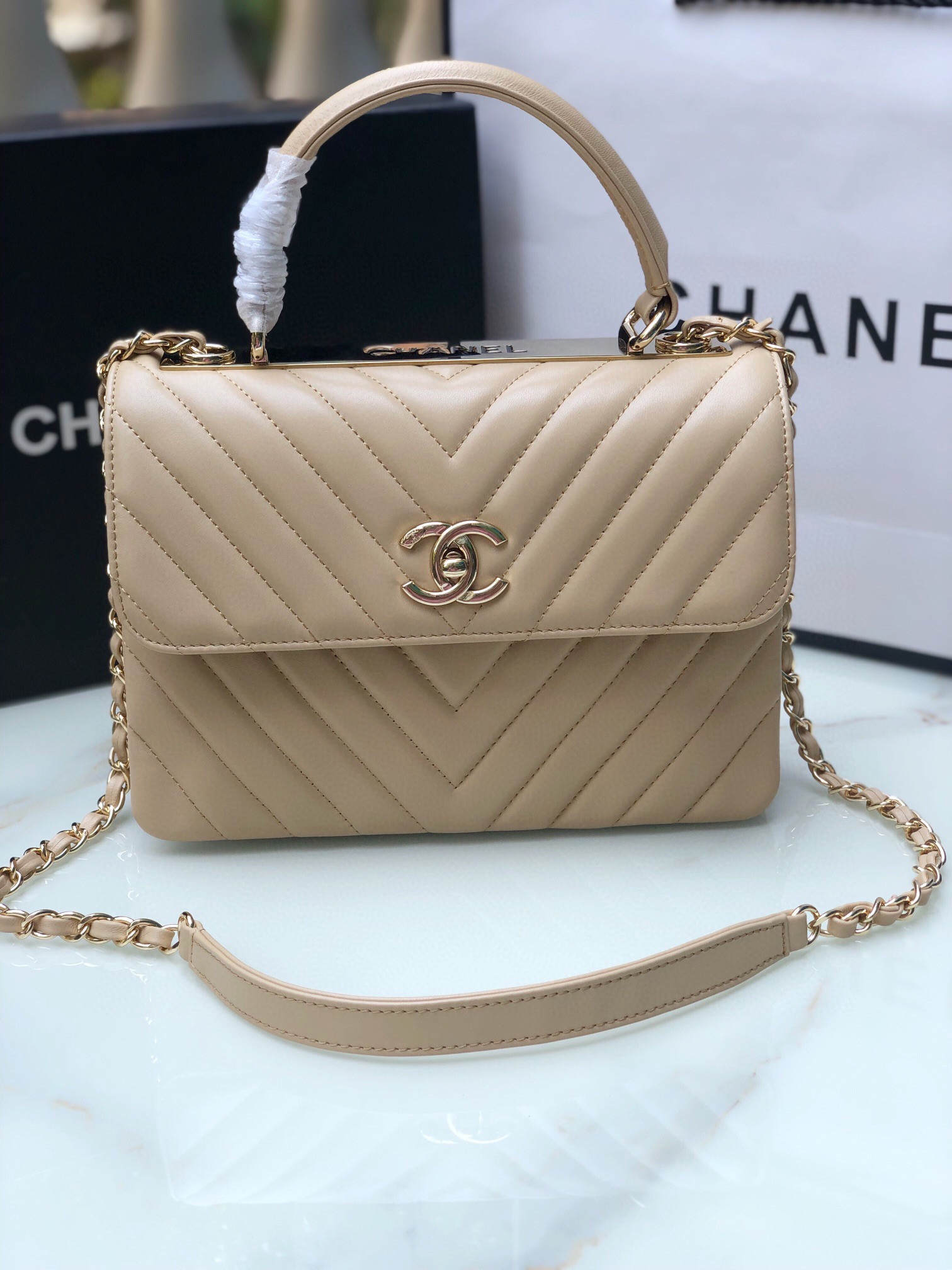 Ch*el flap bag with top handle beige 6.6 × 9.8 × 4.7 in