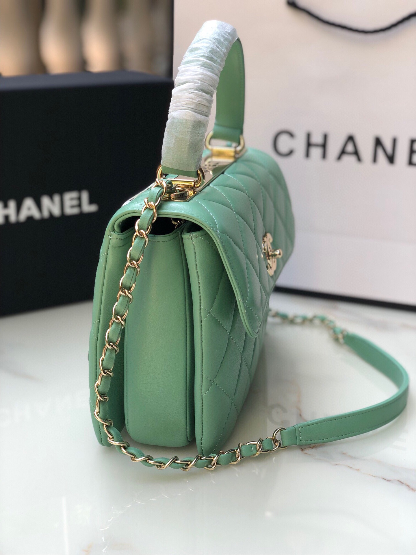 Ch*el flap bag with top handle 6.6 × 9.8 × 4.7 in
