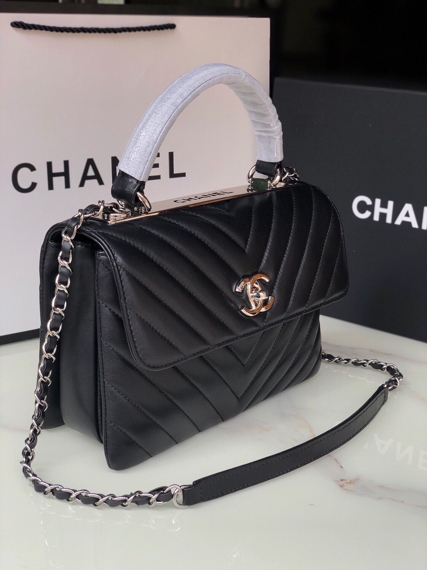 Ch*el flap bag with top handle 6.6 × 9.8 × 4.7 in