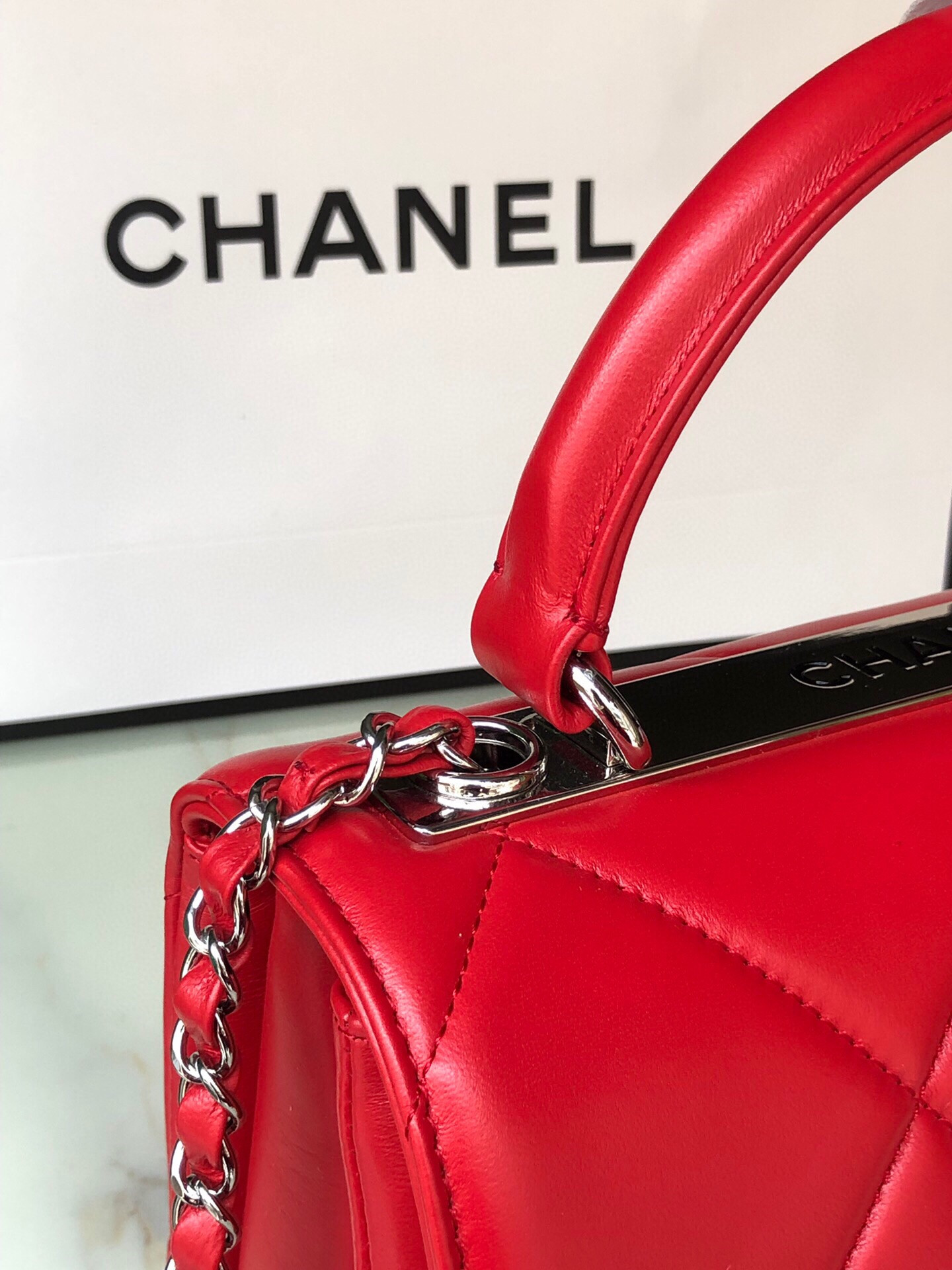 Ch*el flap bag with top handle 6.6 × 9.8 × 4.7 in