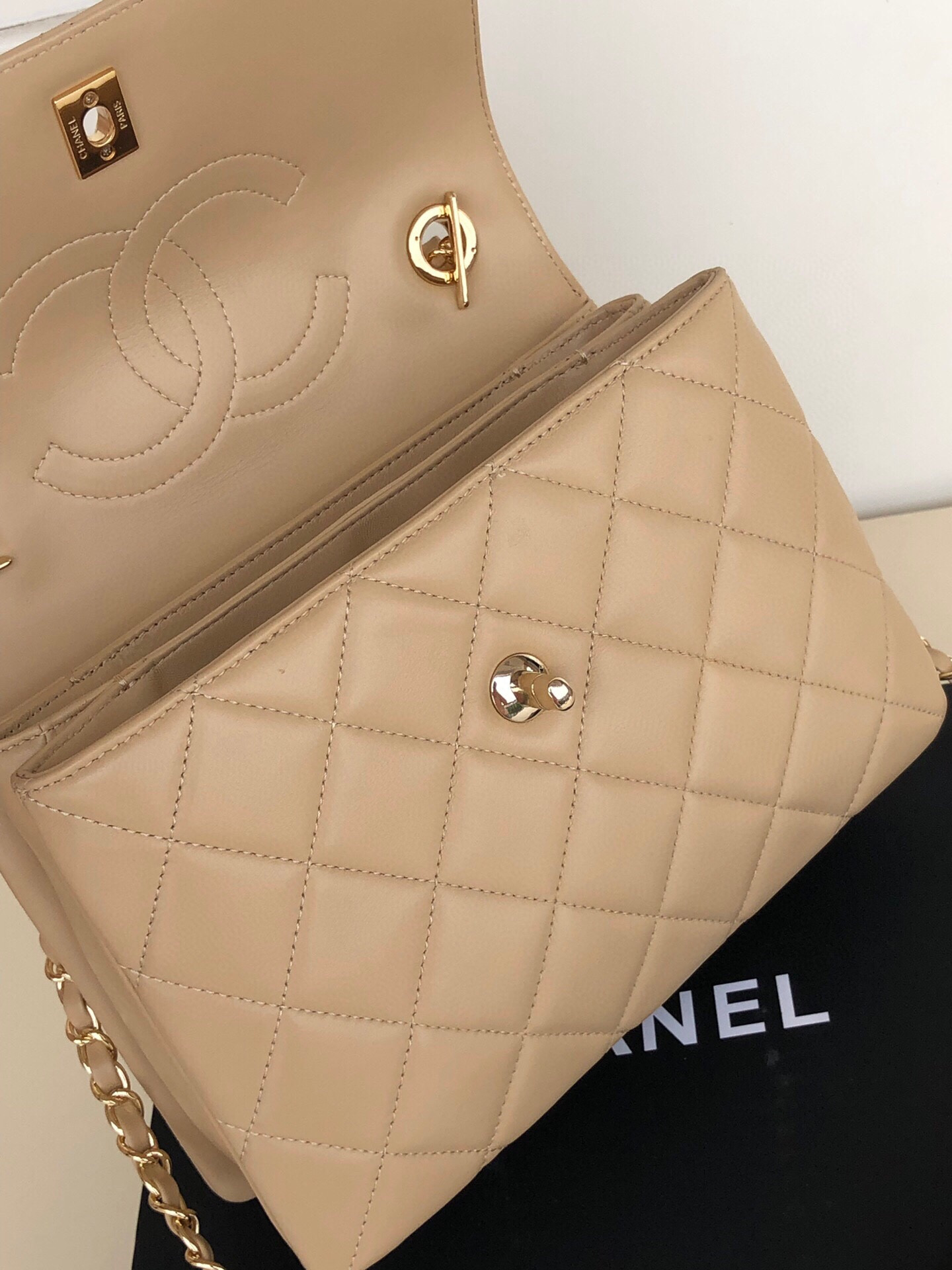 Ch*el flap bag with top handle 6.6 × 9.8 × 4.7 in