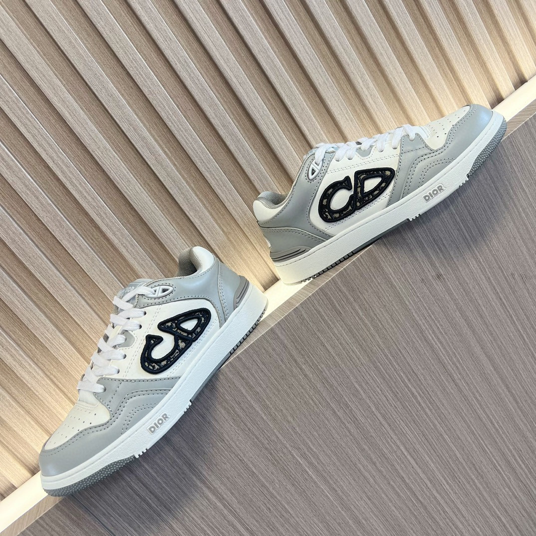 ua D*or b57 low-top sneaker  gray and white