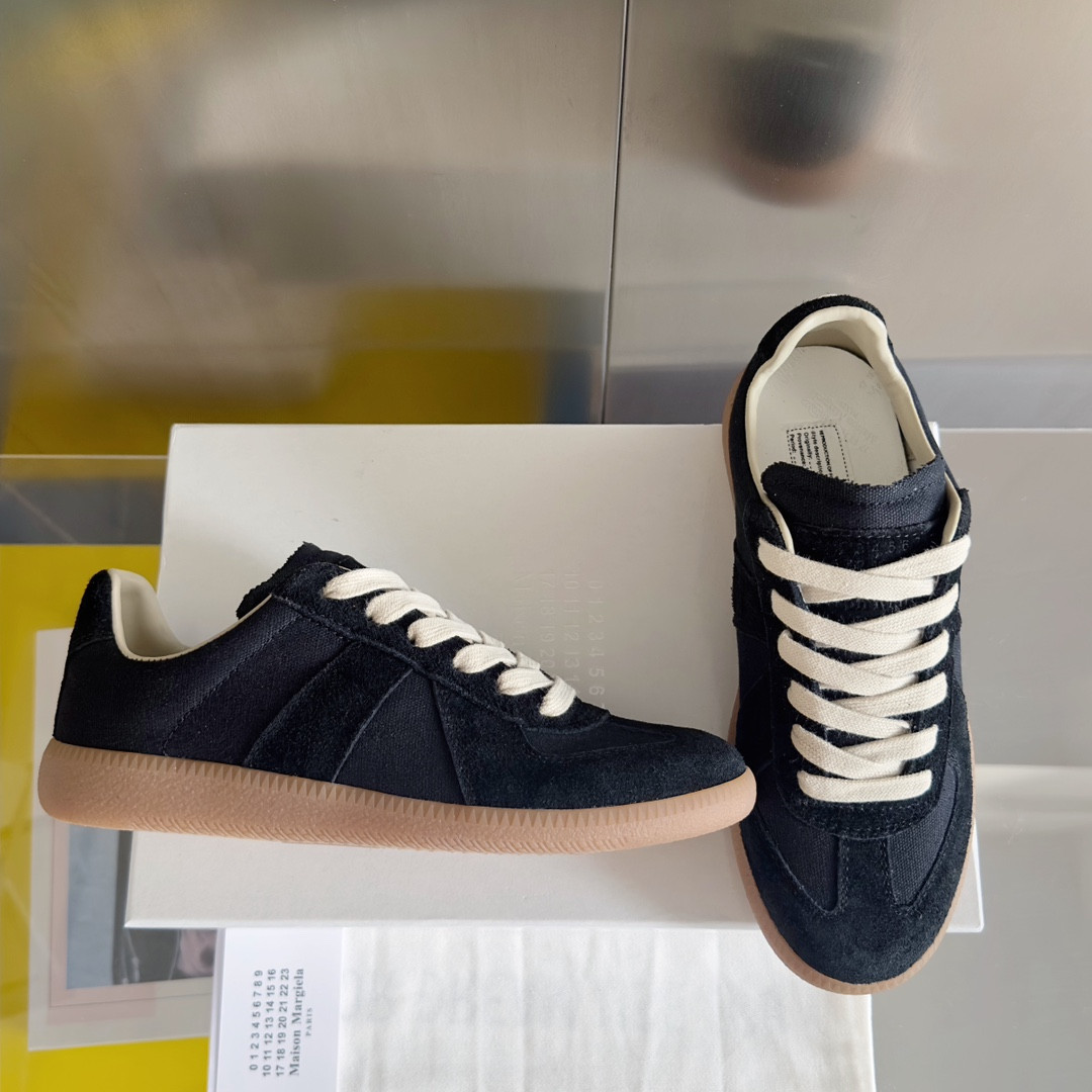ua ma*s*n Ma*i*la mm6 sneakers