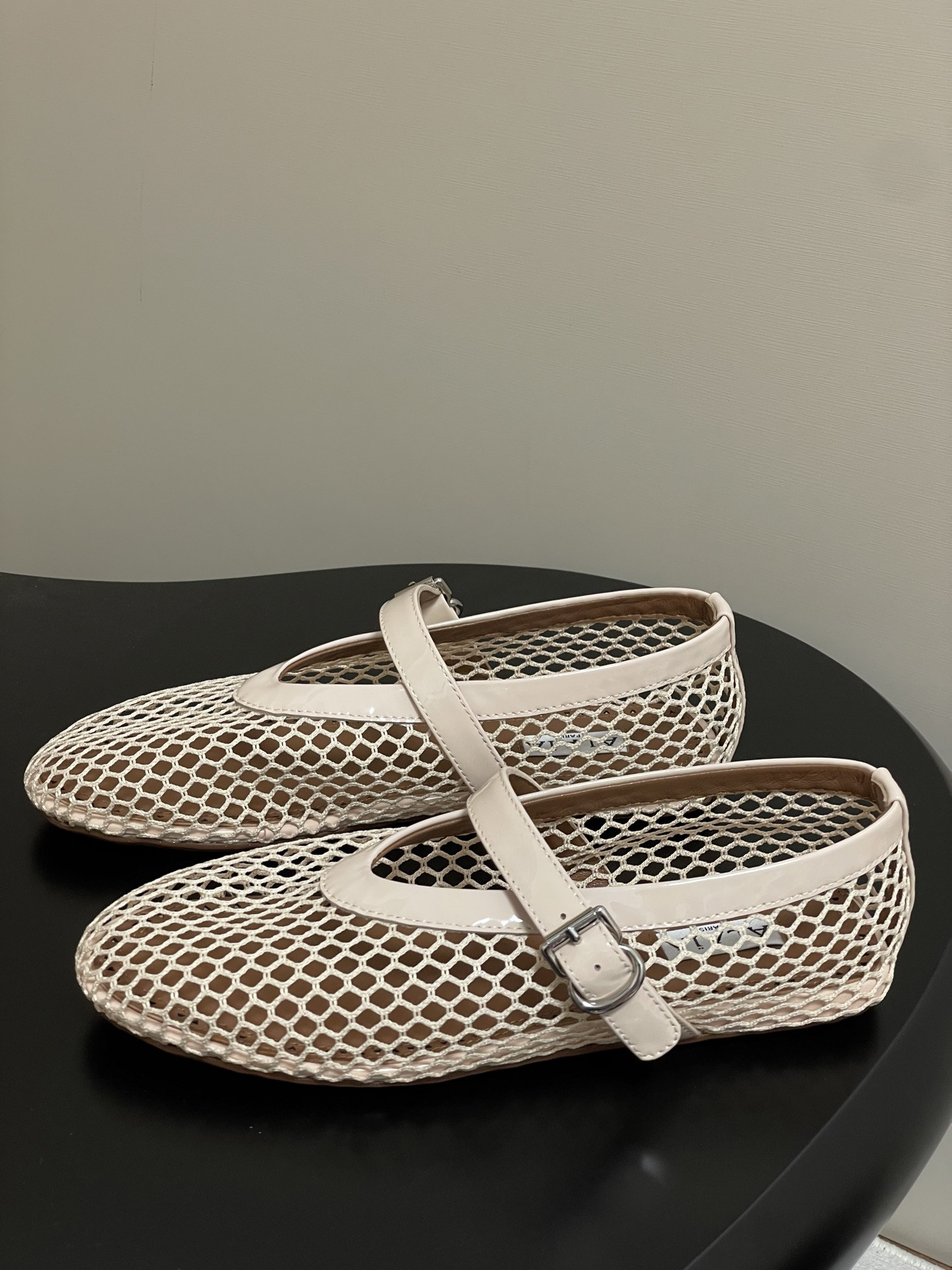 UA ALAÏA BALLET FLATS IN FISHNET